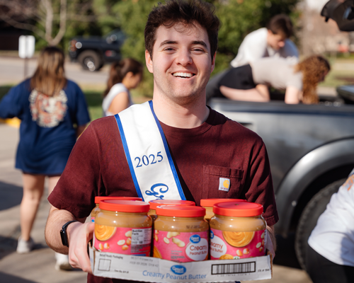 Student helping at food drive.